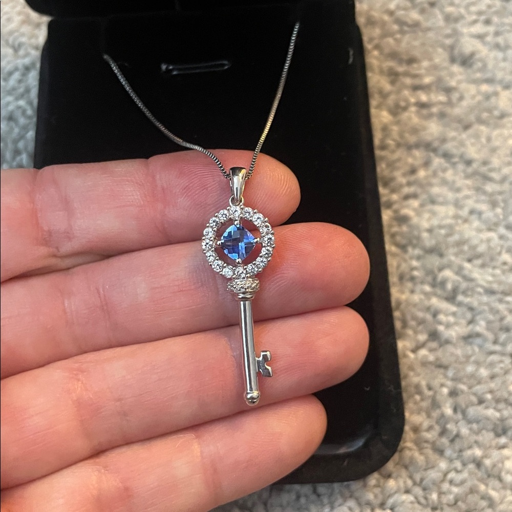 Elegant Sterling Silver Key Pendant blue topaz